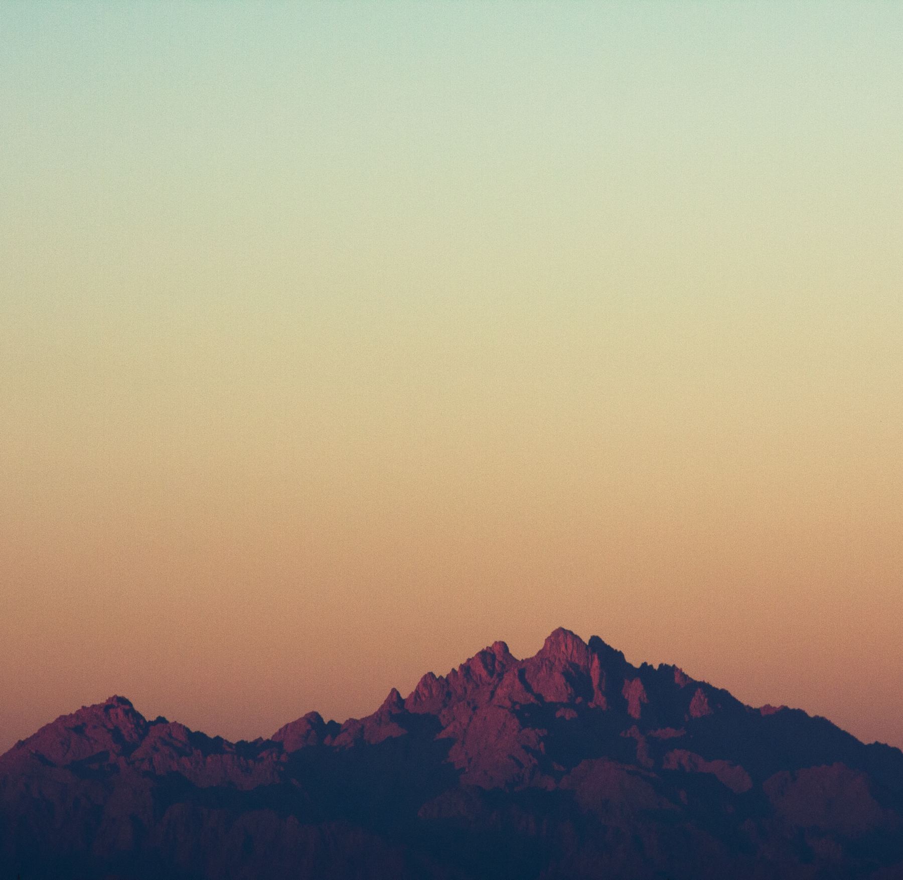 Red Sea mountains silhouetted against a dusk sky